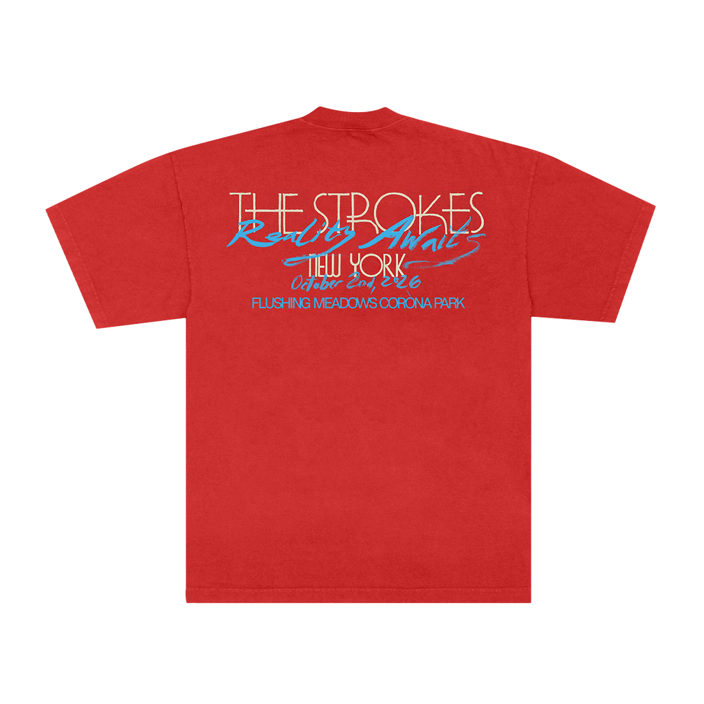 A red short-sleeve t-shirt shown from the back, featuring a graphic print with the text 'THE STROKES' in white outlined letters, 'Rolling Animals' in blue script, 'New York' in orange, and additional blue text below, displayed on a solid white background.