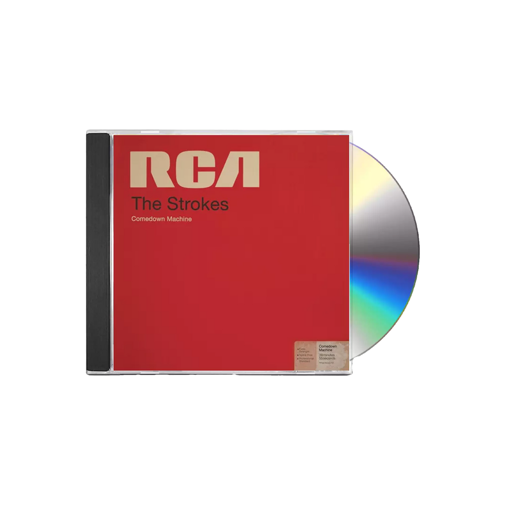 The album artwork for The Strokes' Comedown Machine CD is displayed flat against a plain, The cover mimics a vintage RCA magnetic tape box, featuring a bold, textured red background with a prominent yellow stripe down the left side and a classic, cream-colored RCA manufacturer label across the top. The album title is stamped in a minimalist, black sans-serif font across the center, giving the packaging a retro, analog media aesthetic.