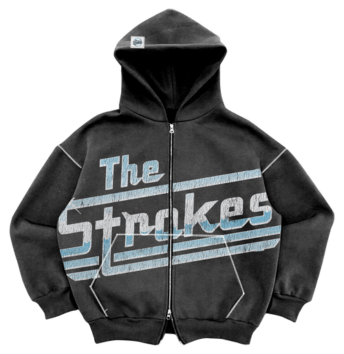 An oversized grey/black hoodie with double zipper, pockets, and a drawstring-free hood, featuring 'The Strokes' text and logo in blue and white across the front body