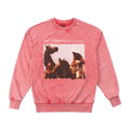 A bright pink crewneck sweatshirt featuring a front graphic print of The Strokes' 'Reality Awaits' album artwork with a cowboy on horseback.