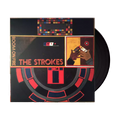 The vinyl LP packaging for The Strokes' album Room on Fire The cover features an oil painting artwork dominated by textured brushstrokes in shades of gold, black, red, and cream, depicting a stylized figure and abstract forms. The band's name, "THE STROKES" and the album title, "room on fire," are written in a small, elegant cursive script in the upper-right corner, maintaining the album's signature classic art aesthetic.
