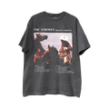 A dark gray graphic t-shirt featuring a western-themed print of a cowboy on horseback with the text 'THE STROKES REALITY AWAITS' on the top and the album tracklist below.