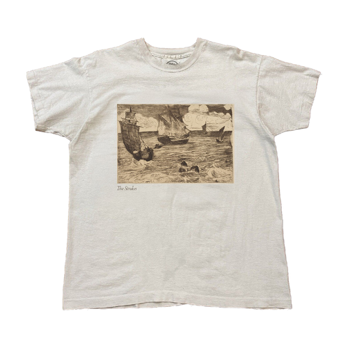 White t-shirt with a vintage-style graphic of ships on water in between waves. A small The Stokes text is written underneath the image on the lower left. 