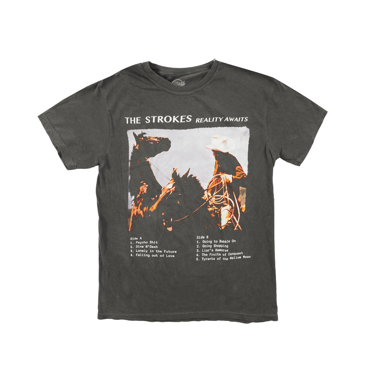 A black short-sleeve graphic t-shirt featuring the album artwork for 'The Strokes - Reality Awaits' on the front.