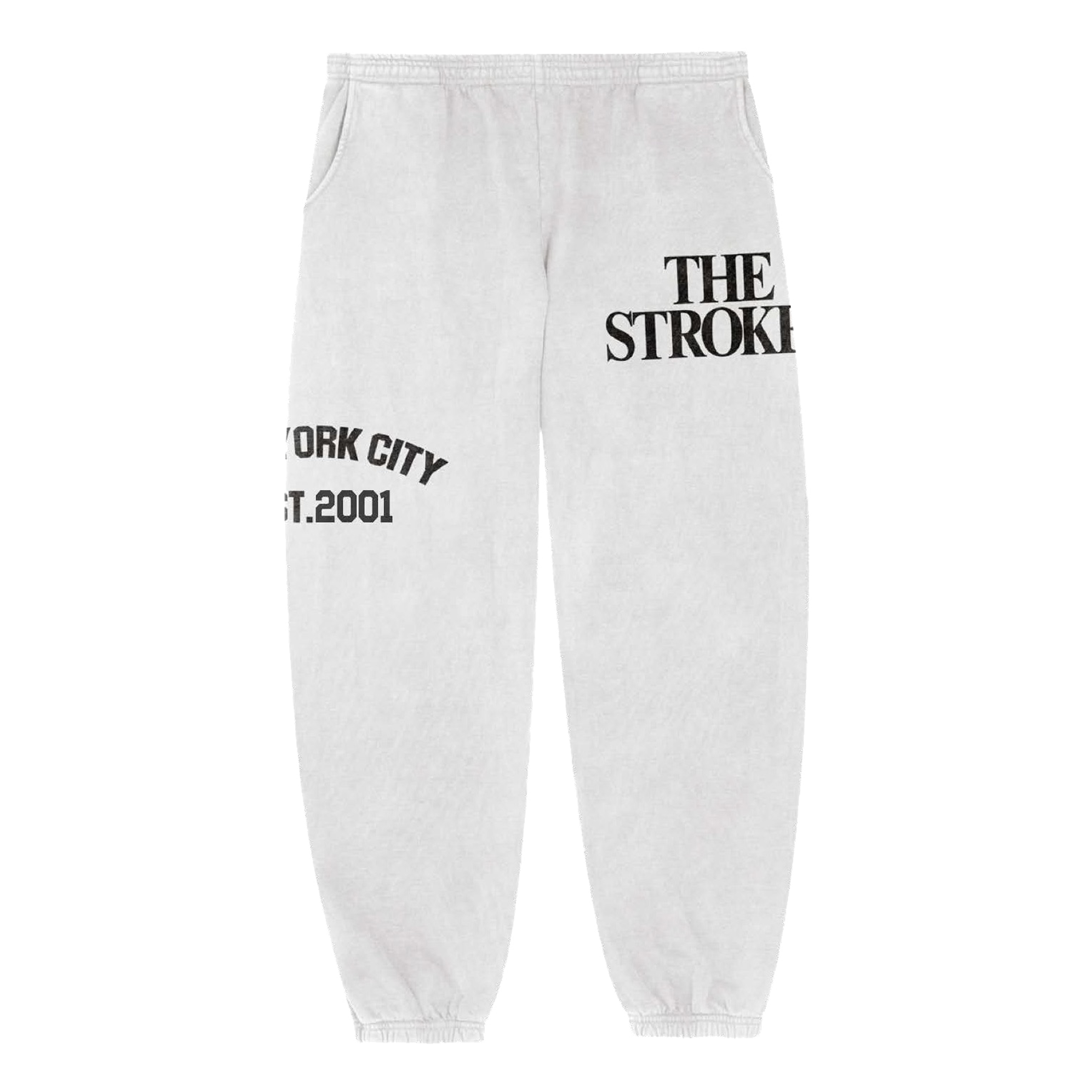 White fleece sweatpants with the text 'THE STROKES' printed on the left upper thigh and 'NEW YORK CITY EST. 2001' printed across the right thigh.