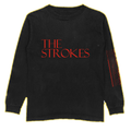 Black long sleeve with 'The Strokes' text in red on the front chest and 'The Singles Volume 01' and other faint text printed in red on the left sleeve.