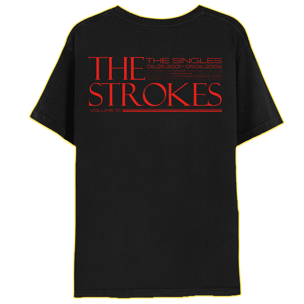 The back of a black shirt with "THE STROKES" in red prominently with The SINGLES, 06.25.2001-09.06.2006 and Volume 1" surrounding in smaller text 